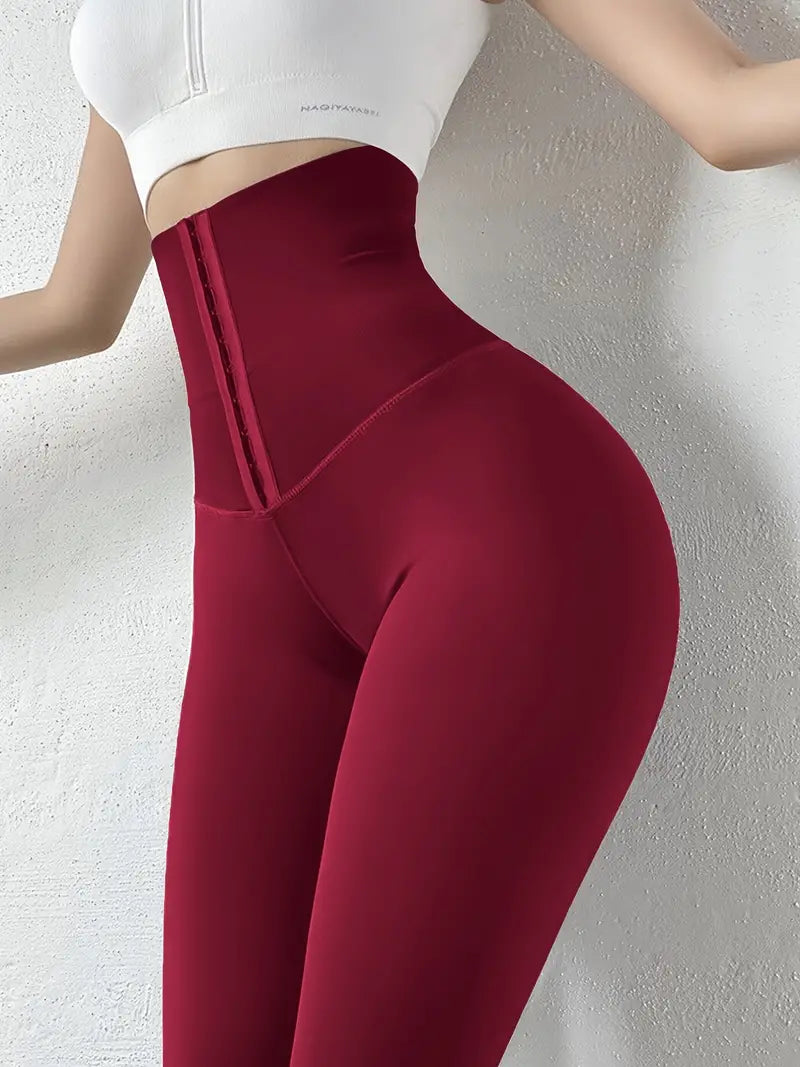 Calça colante de cintura alta com fivelas para compressão de barriga
