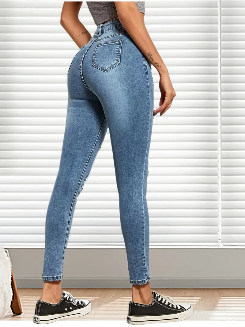 Calça jeans skinny rasgada de cintura alta