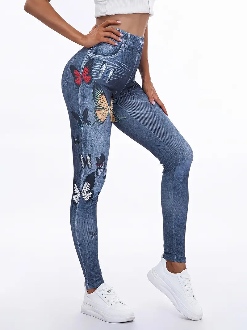 Calça colante jeans com estampas de borboleta